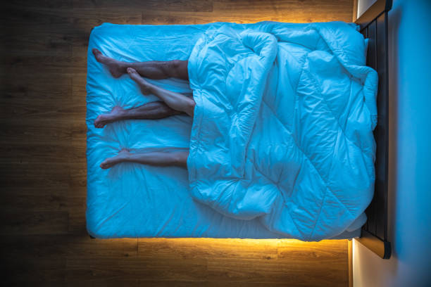 istock The couple laying under a blanket. evening night time, view from above 1077204004