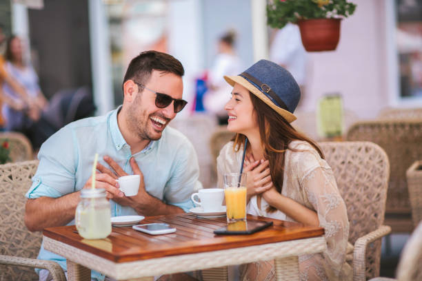 istock Beautiful couple having coffee on a date 1077204620