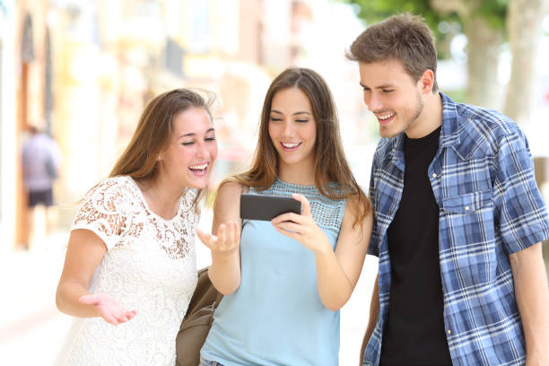 istock Friends watching media content on a smart phone 1077205710
