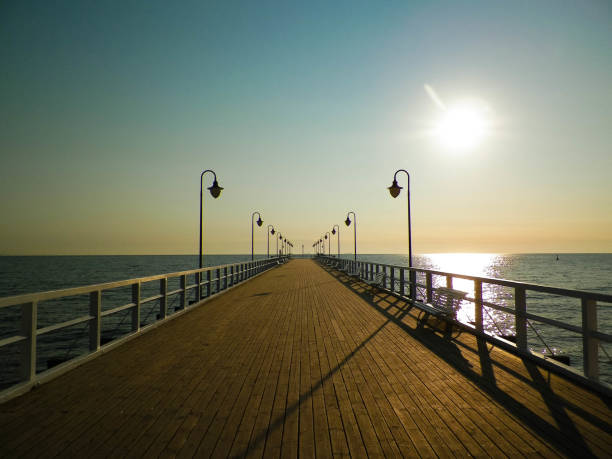 istock Sunrise over pier in Gdynia, Poland. 1077206682