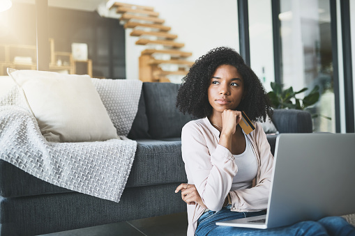 Shot of an attractive young woman relaxing at home