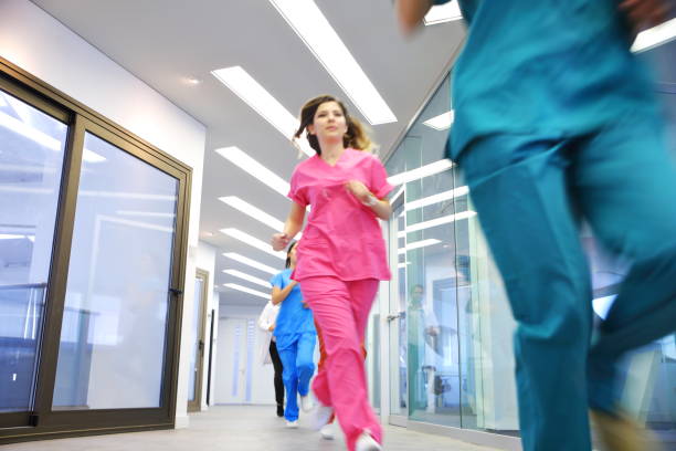 istock Doctors and nurses rushes for emergency in hospital corridor 1077209318