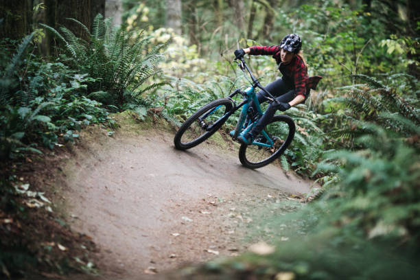 istock Woman Mountain Biking On Forest Trails 1077209384