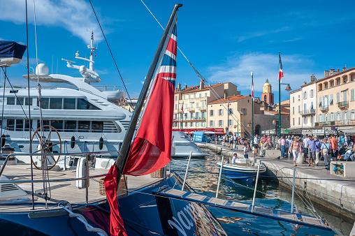 Promenade Quai Jean Jaures with yachts and tourists in Saint-Tropez in the Department Var of the province Provence-Alpes-Cote d Azur