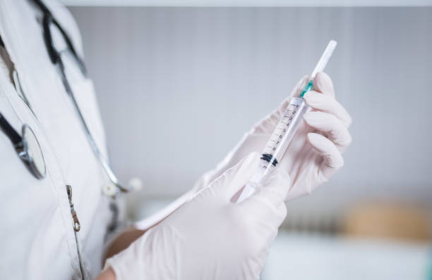 istock Female doctor with syringe 1077215062