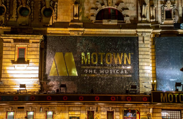 The outside of the Shaftesbury Theatre The outside advertising for the Motown Story, on at the Shaftesbury Theatre on Shaftesbury Avenue, London, England, UK. This is taken at night at the end of November 2018. soho billboard stock pictures, royalty-free photos & images