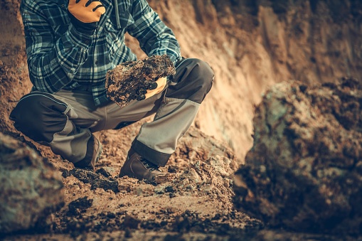 Caucasian Geologist Checking the Soil in the Construction Site.