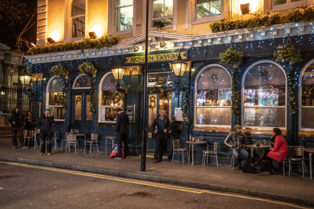 The Museum pub near the British Museum with Christmas lights in the window to attract Christmas Shoppers in late November 2018.