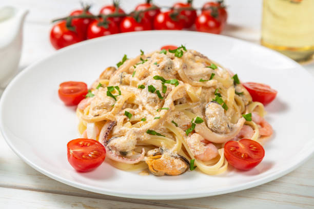 istock Pasta with seafood in cream sauce 1077216692