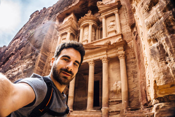 istock Young traveller taking a selfie in Petra 1077227866