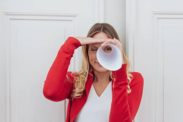 Playful woman playing I Spy with the camera