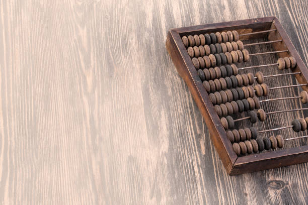 istock Accounting abacus on wooden textured background 1077231472