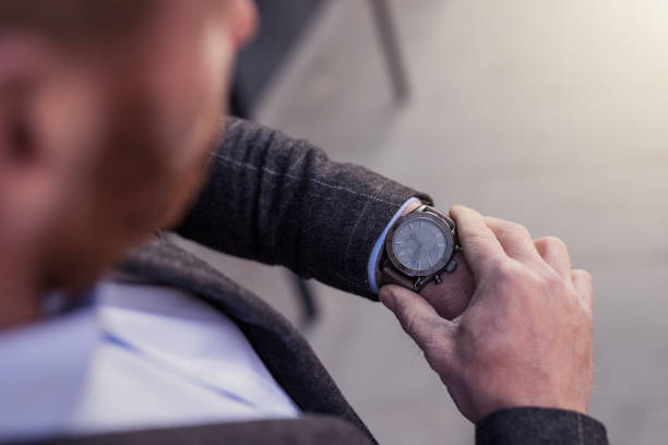 istock Mid adult man checking time. 1077234330