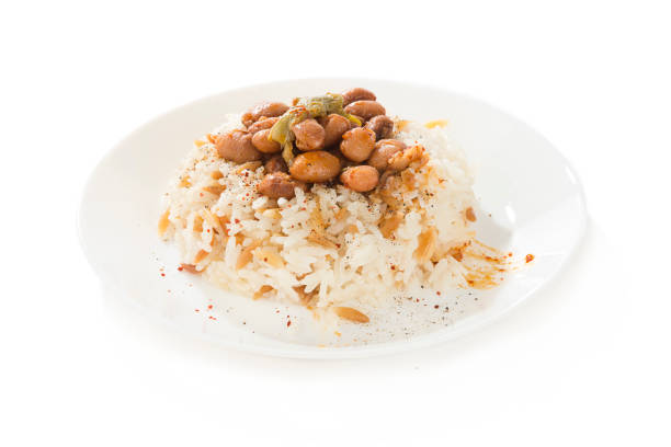 Traditional Turkish food called Kuru fasulye pilav isolated on white background.