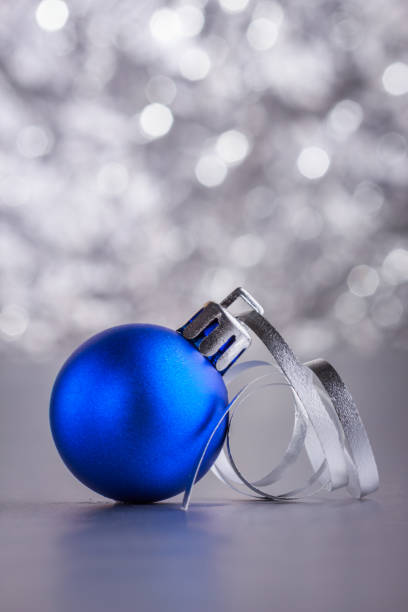 istock Christmas composition of Christmas tree toys on a blurred silver background 1077240592