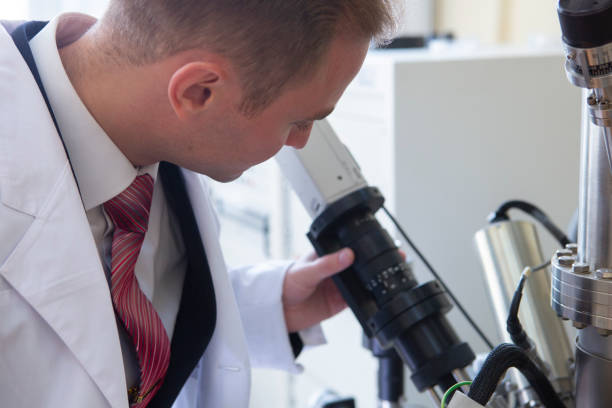 istock laboratory specialist examines the data obtained on a special apparatus for analyzing samples 1077244108