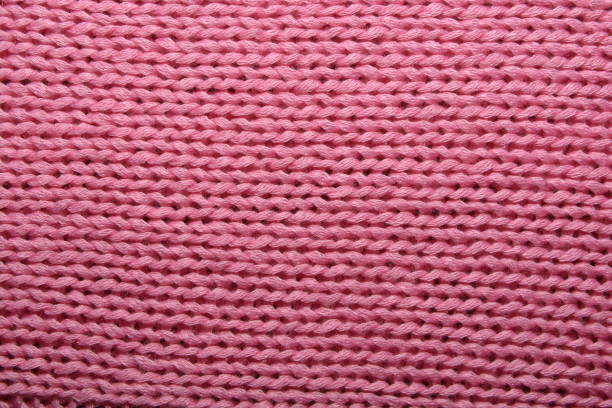 istock Texture pink knit fabric for the background 1077247356