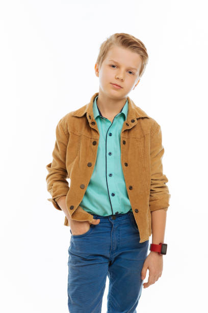 istock Nice serious boy putting a hand in his pocket 1077248682
