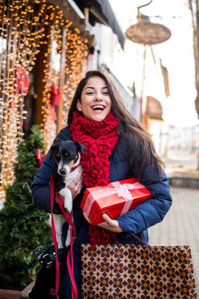 Woman Christmas shopping with dog