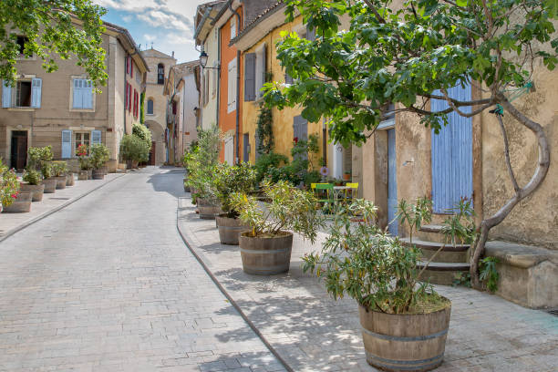 Narrow street leading up to the church in Cucuron, Provence, Luberon, Vaucluse,  France