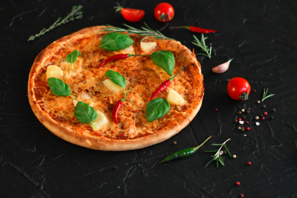 pizza, pineapple, chicken, tomato sauce, cheese, basil (pizza ingredients). Hawaiian pizza. Top view. copy space
