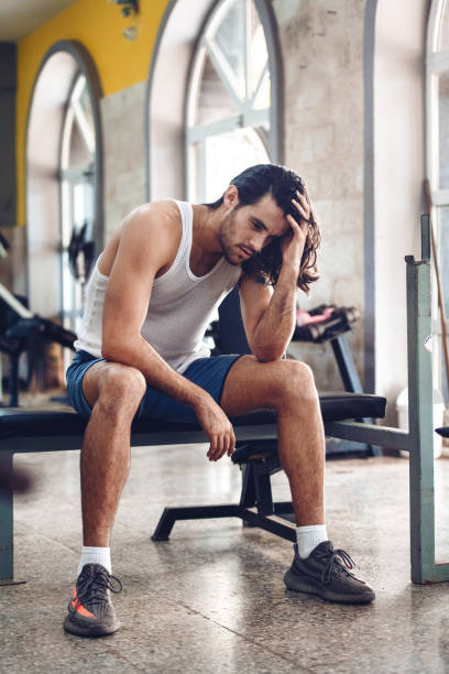 istock Latino man training in a gym 1077260440