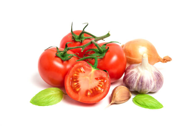 istock Fresh tomatoes, garlic and onion isolated on white background 1077265746