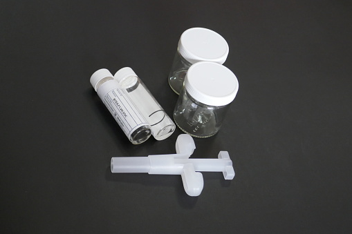 Standard sampling containers and bottles used to collect soil and groundwater samples to be analyzed by a laboratory for environmental pollutants.