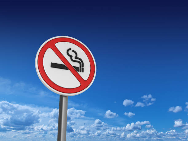 NO SMOKING Road Sign - Sky Background - 3D Rendering stock photo