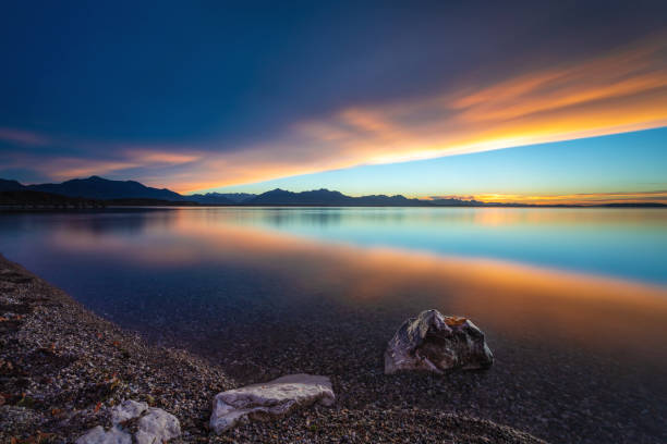 spectacular sunset and stones in the water