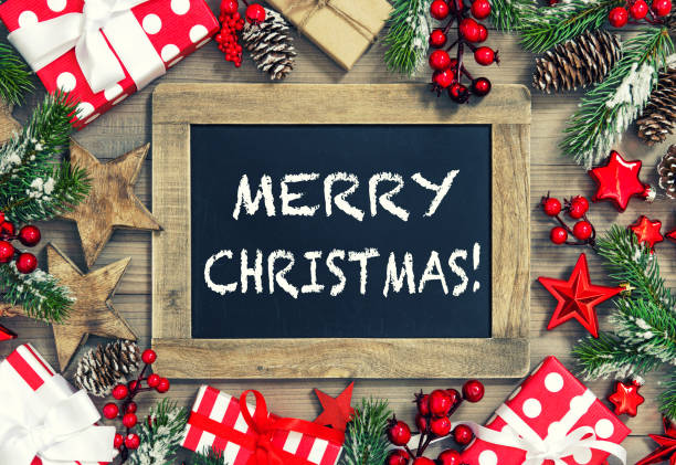 istock Christmas tree branches chalkboard gifts decoration vintage 1077268170