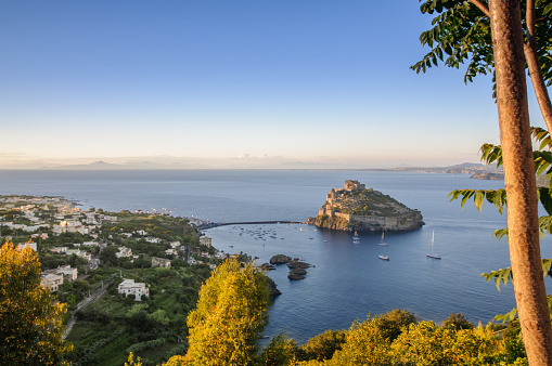 Aerial view on Aragonese castle at sunset, Ischia, Italy