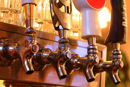 multiple beer taps in bar
