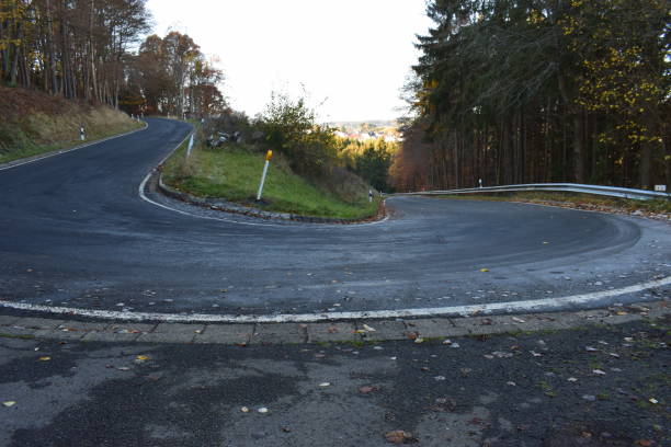 istock hairpin curve in autumn, Eifel 1077274024