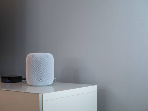 istock Smart wireless speaker at home to play music. Grey an white background. 1077275106