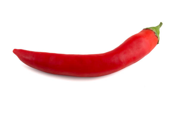 istock Chili peppers on a white background. Fresh chili pepper close up. One red pepper on a white background. 1077282928