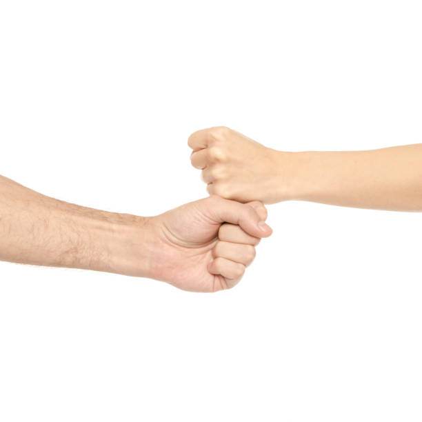 istock Two hands holding each other strongly fists 1077283402