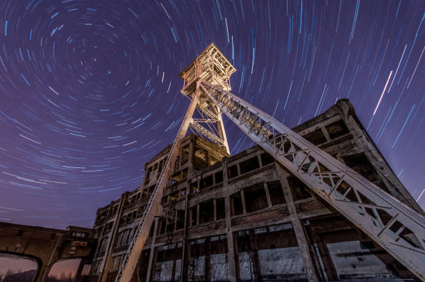 View at the metal container with stairs under the star sky at night.