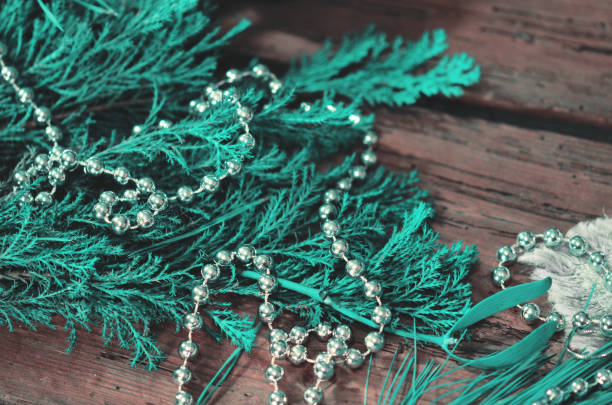 Branch of Christmas tree on wooden background.  Tree branches Christmas decoration.