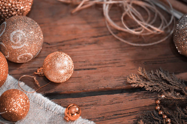 istock Fur tree branches, balls, rope on rustic wooden table background 1077289524