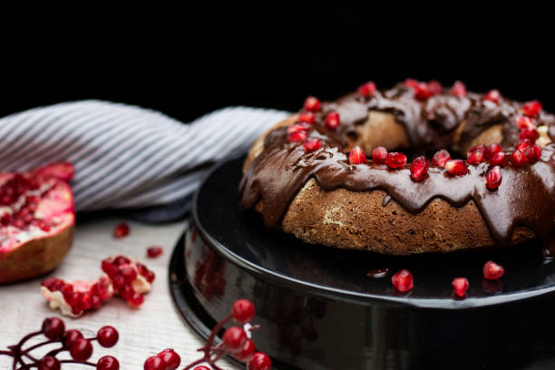 istock Cake with Chocolate Glaze and Pomegranate Seeds. 1077291320