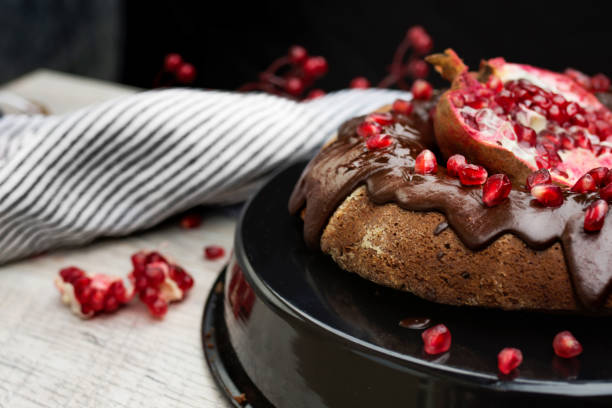 istock Cake with Chocolate Glaze and Pomegranate Seeds. 1077291380