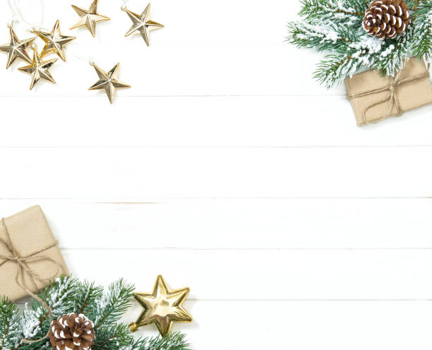 istock Christmas tree branches gifts golden ornaments 1077292166