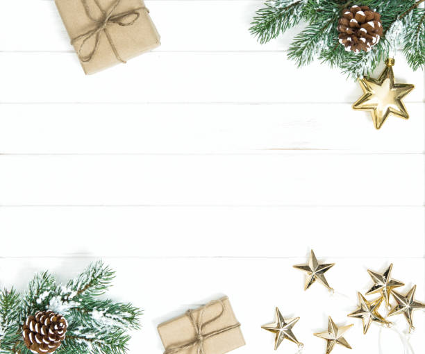 istock Christmas tree branches gifts golden ornaments 1077292174