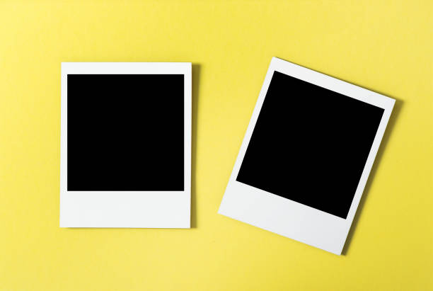 istock Retro style photo frames yellow background 1077293774