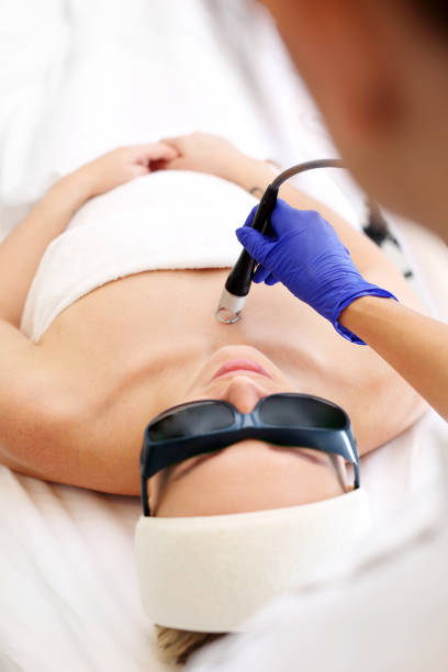 istock laser treatment for the face. 1077294100