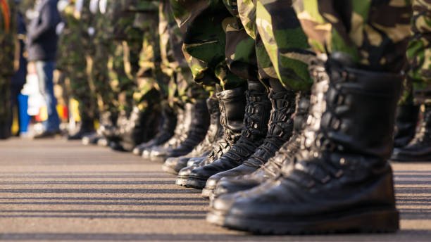 istock Army boots close up in line on parade day 1077294110