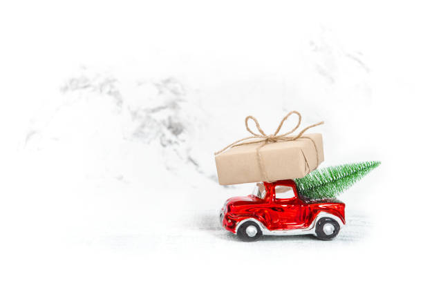 istock Red car gift box Christmas tree Copy space 1077294386