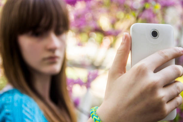 istock teenage girl make selfie 1077294574