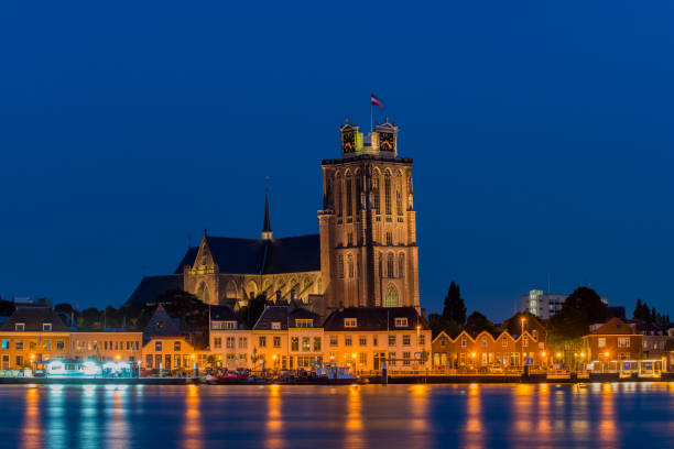 Skyline of Dordrecht, The Netherlands Riverside view with a medieval church photographed during the evening blue hour dordrecht photos stock pictures, royalty-free photos & images